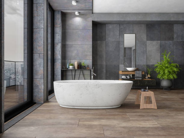 Bathroom tile dark flooring with bath tub | Carpets And More, Inc