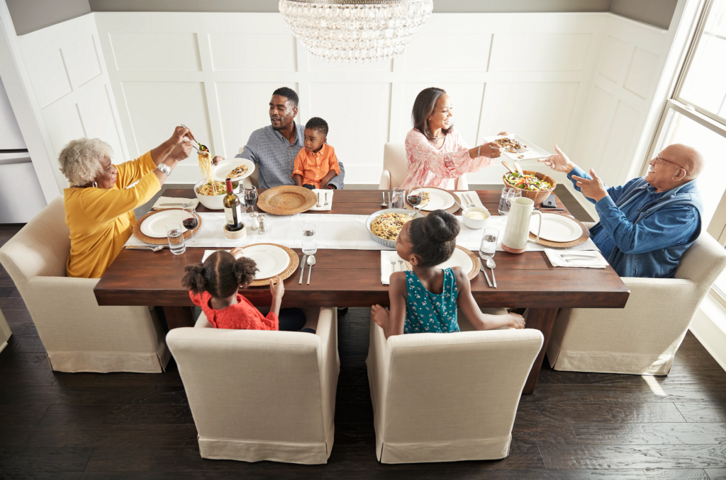 Family having breakfast at the dining table | Carpets And More, Inc